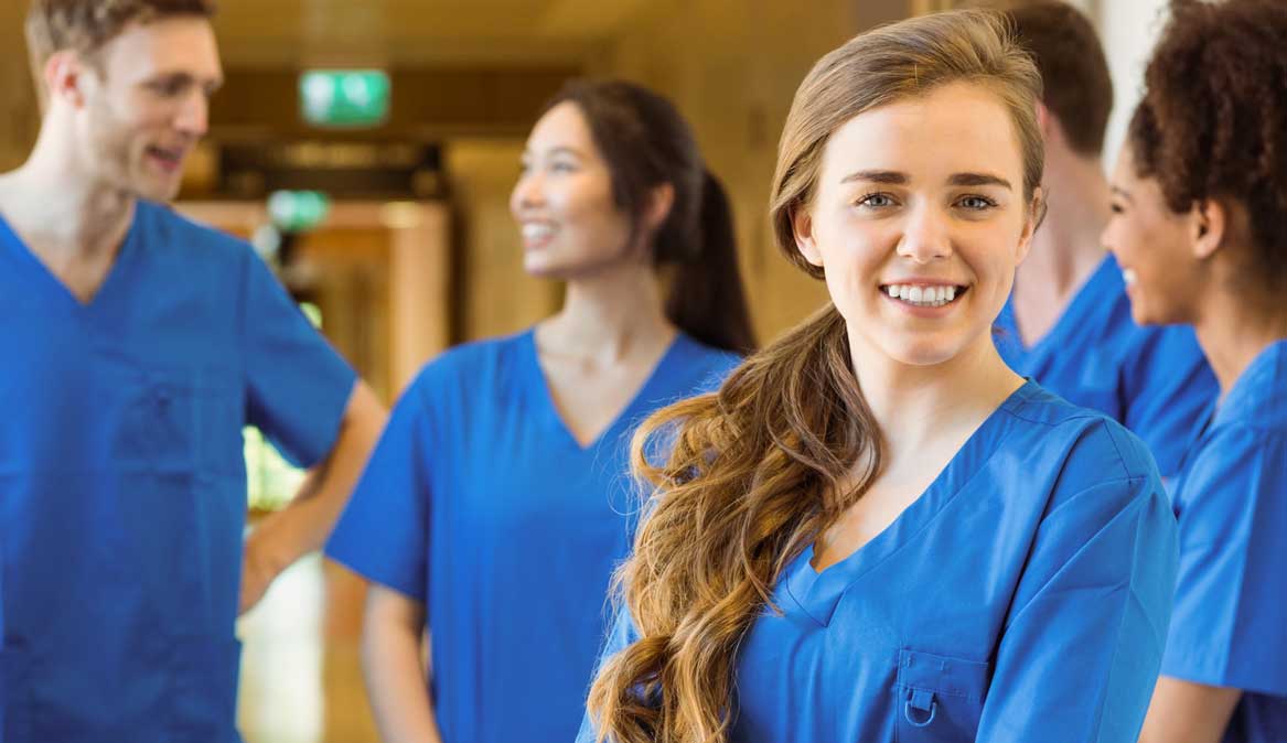 247 nursing & medical services, overseas nurse placements, nursing agency, young female nurse with colleagues in background